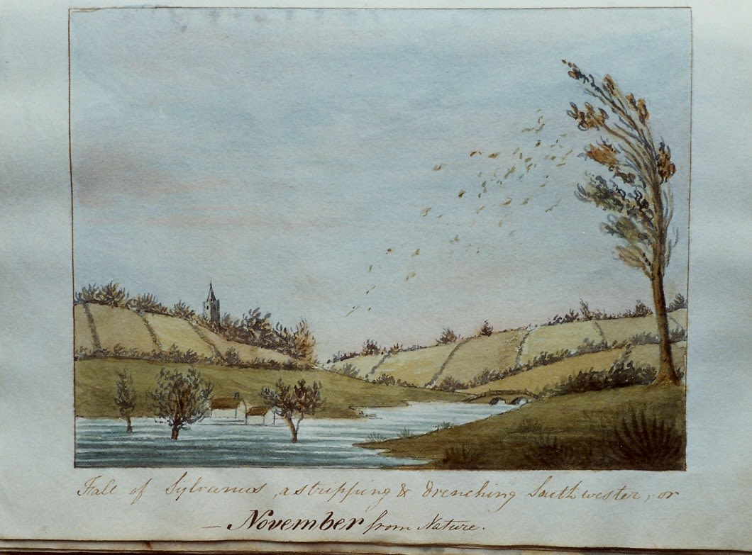 Watercolour scene of a stream in flood with three trees and two cottages in water. A tree on the right is bent in the wind and is shedding leaves. There is a bridge over the stream in the middle background and a church with a spire on a hill. Caption “Fall of Sylvanus as stripping and drenching southwester or November from Nature”.