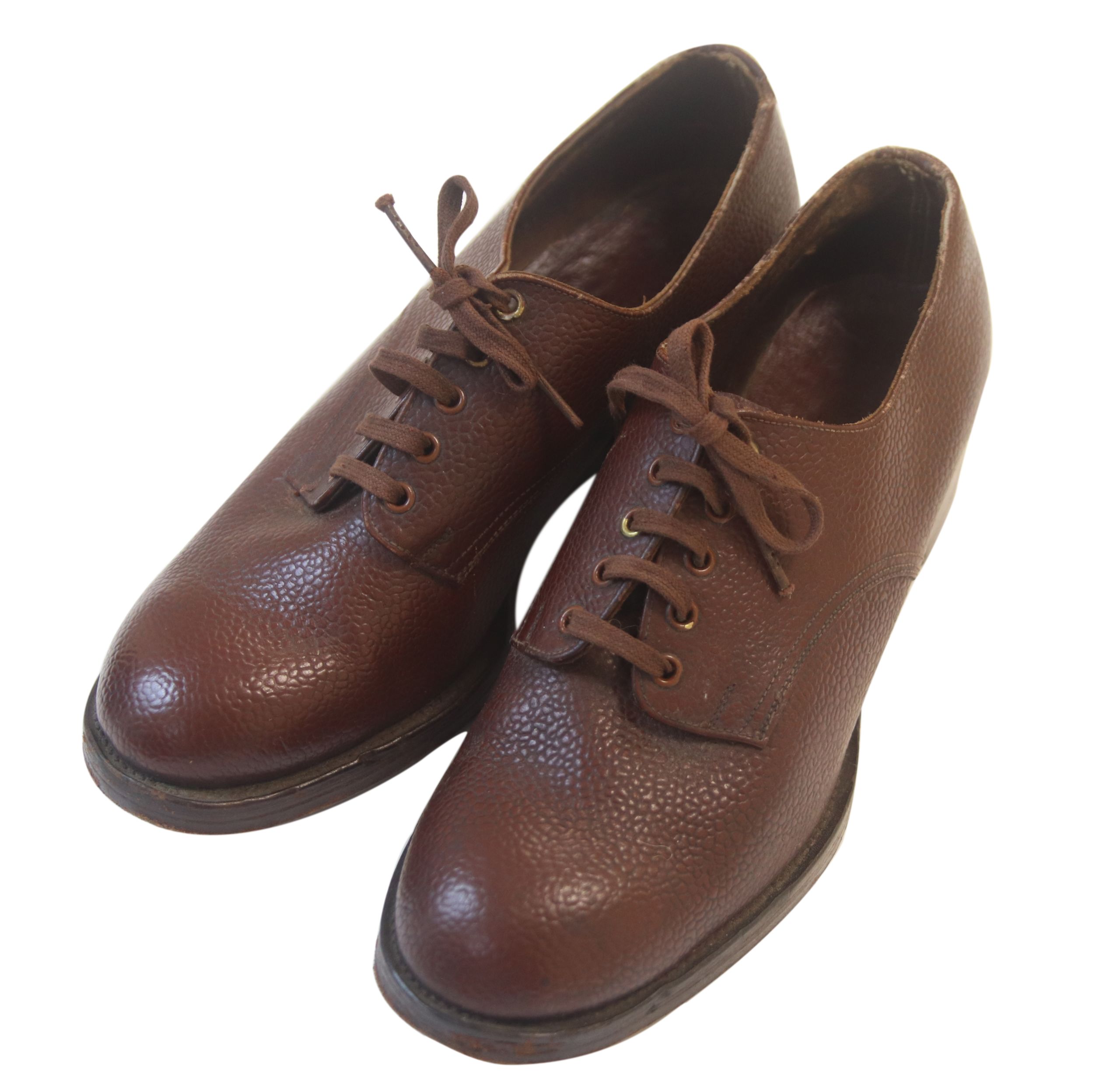 Colour photograph of a pair of very sturdy looking brown leather lace up shoes.