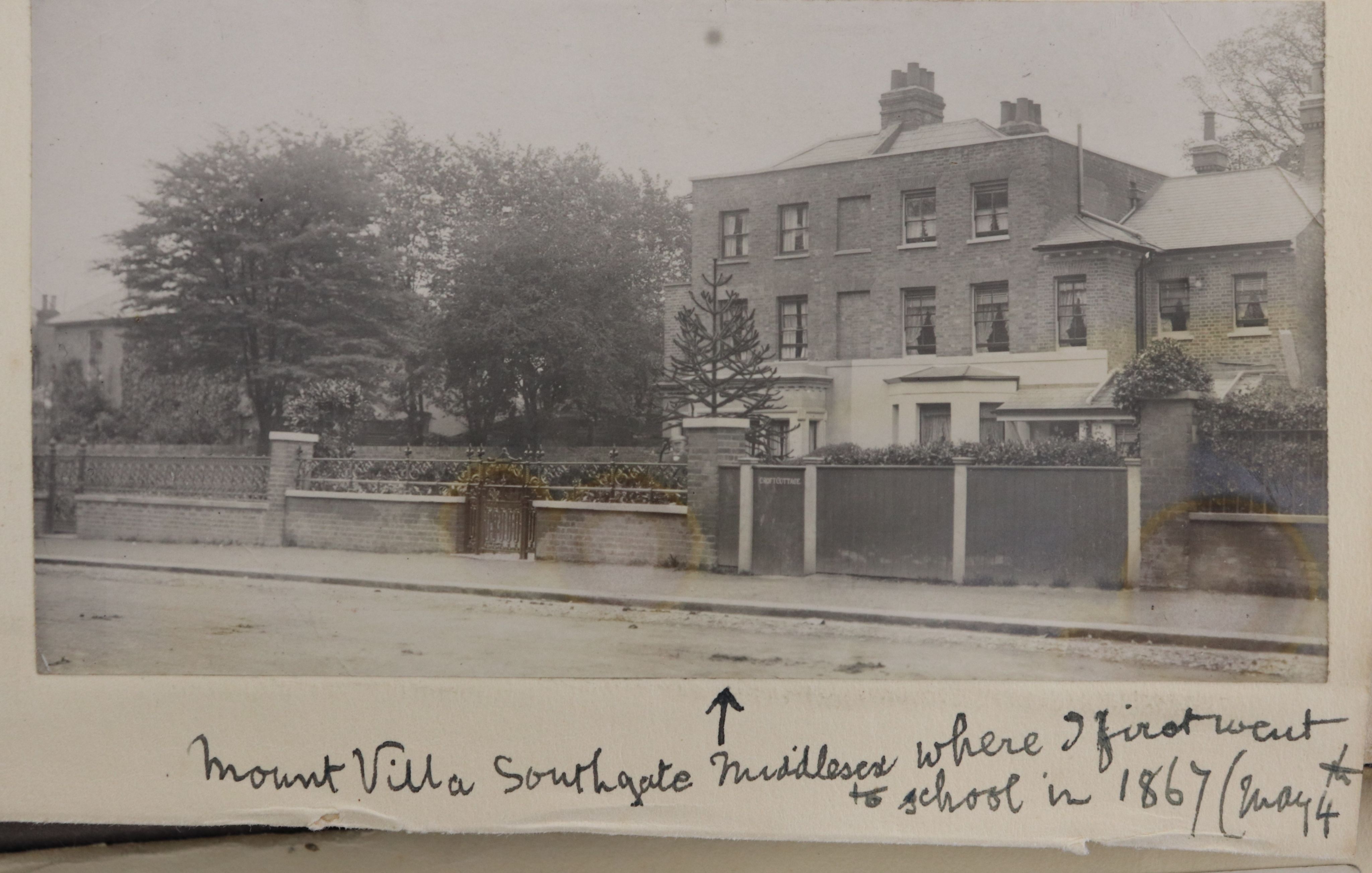 Sepia photograph of a large, detached, three-storey town house