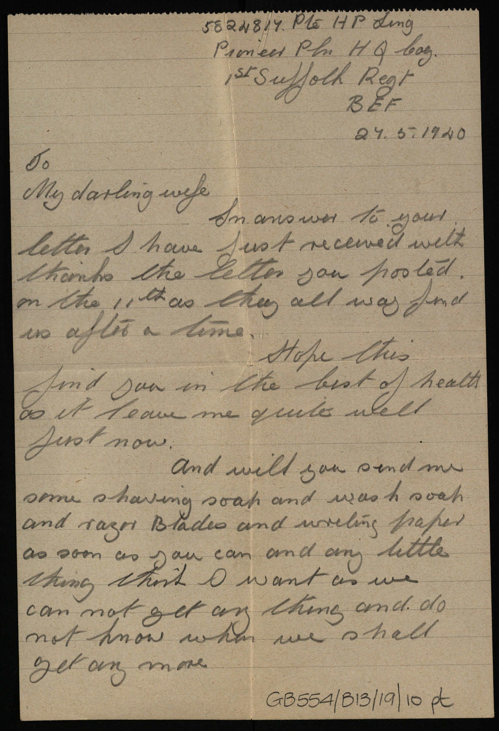 Photograph of a handwritten letter in pencil on lined paper. The writing is slanted and the letter begins To My Darling Wife. The paper has yellowed with age.