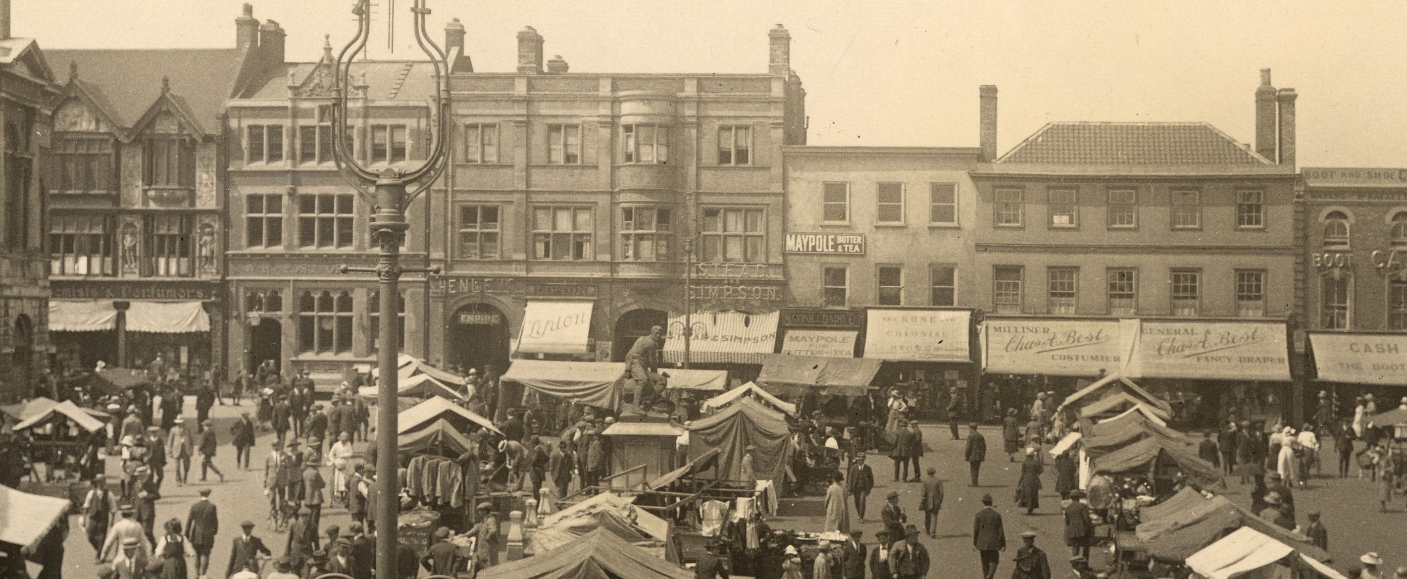 Sepia photo showing a busy market scene